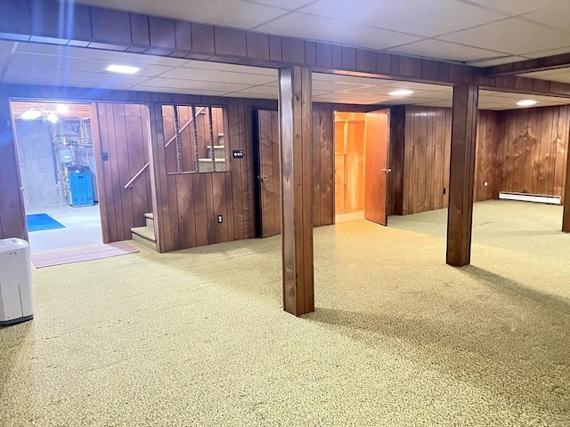 216 Bel Air Dr, Longmeadow, MA 01106 - finished basement with a baseboard radiator, carpet floors, wood walls, stairway, and a paneled ceiling