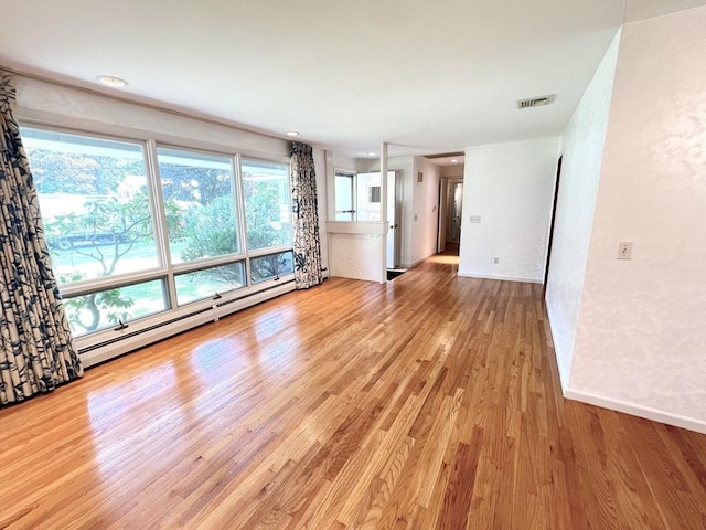 216 Bel Air Dr, Longmeadow, MA 01106 - unfurnished living room with wood finished floors and a baseboard radiator