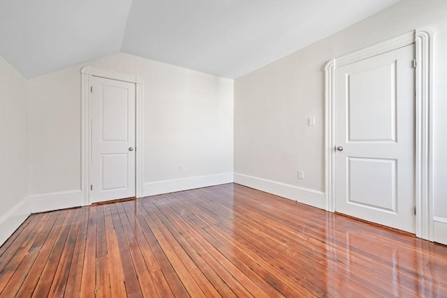 bonus room featuring lofted ceiling and hardwood / wood-style floors