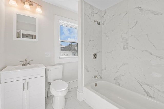 full bathroom featuring tiled shower / bath combo, vanity, and toilet