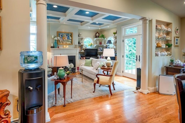 9 Mohawk Rd, Marblehead, MA 01945 - sitting room with ornate columns, wood finished floors, beamed ceiling, coffered ceiling, and a fireplace