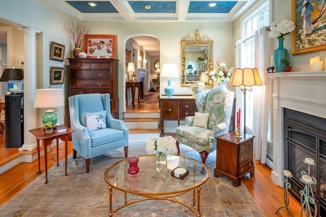 9 Mohawk Rd, Marblehead, MA 01945 - sitting room with wood finished floors, arched walkways, coffered ceiling, crown molding, and beamed ceiling
