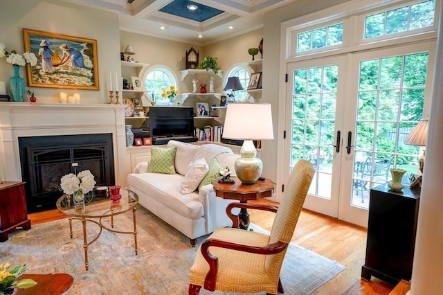 9 Mohawk Rd, Marblehead, MA 01945 - living room with crown molding, plenty of natural light, coffered ceiling, beamed ceiling, and wood finished floors