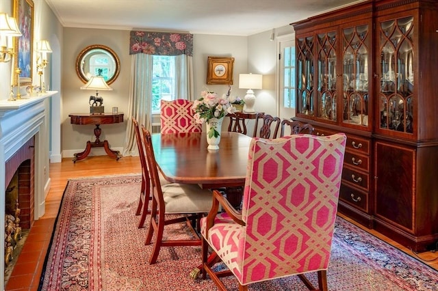 9 Mohawk Rd, Marblehead, MA 01945 - dining room featuring wood finished floors, ornamental molding, and a fireplace