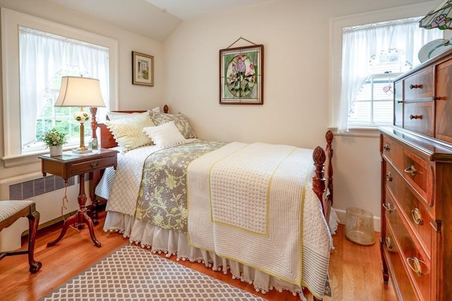 9 Mohawk Rd, Marblehead, MA 01945 - bedroom with wood finished floors, multiple windows, and vaulted ceiling