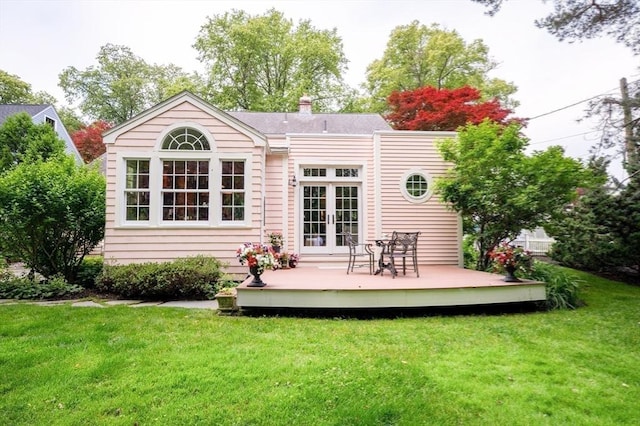 9 Mohawk Rd, Marblehead, MA 01945 - back of house featuring french doors, a deck, a lawn, and a chimney