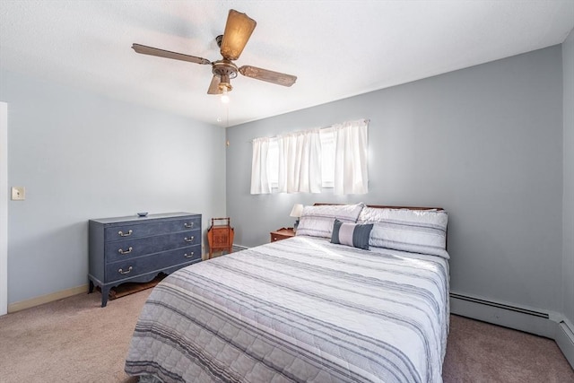 bedroom with a baseboard radiator, carpet, and ceiling fan