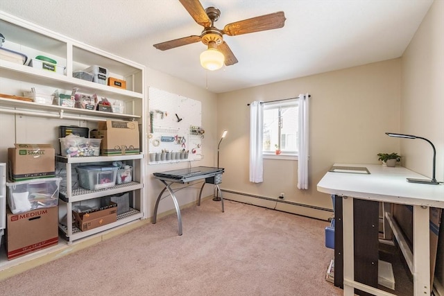 office area with ceiling fan, a baseboard radiator, and light colored carpet