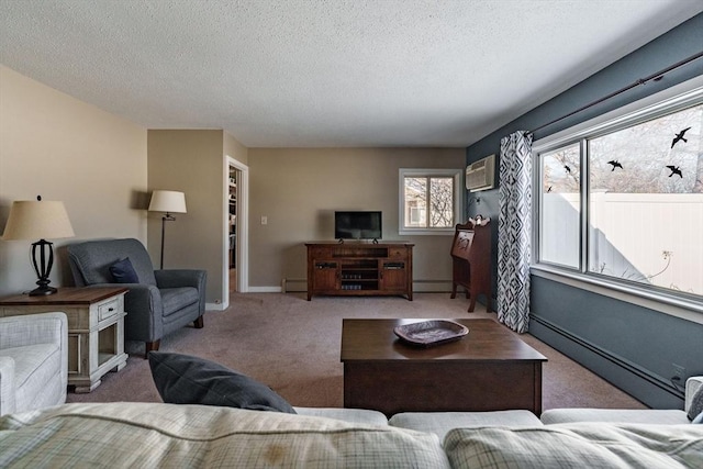 living room with a baseboard heating unit, a textured ceiling, and carpet flooring