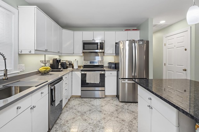 15 Bunker St Unit 2, Boston, MA 02136 - kitchen featuring appliances with stainless steel finishes, white cabinets, recessed lighting, a sink, and dark stone counters