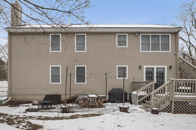 15 Bunker St Unit 2, Boston, MA 02136 - snow covered back of property with stairway, a chimney, and a wooden deck