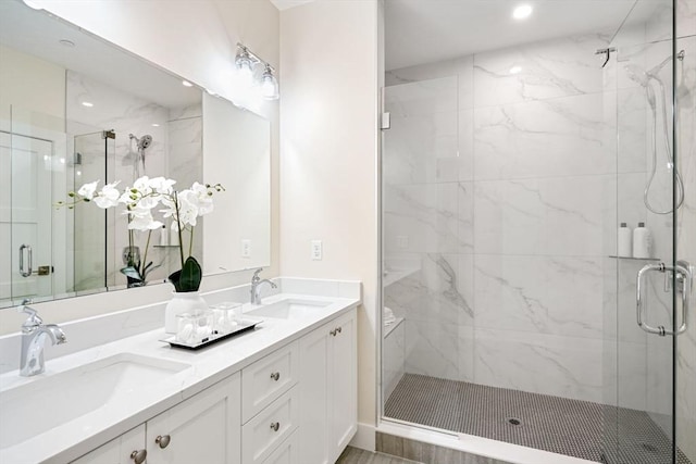 53 Driftwood Cir Unit 20, Sandown, NH 03873 - bathroom with a marble finish shower, double vanity, and recessed lighting