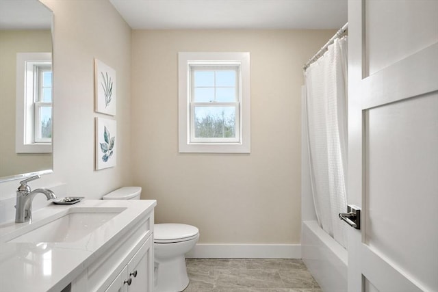 53 Driftwood Cir Unit 20, Sandown, NH 03873 - bathroom featuring healthy amount of natural light, toilet, vanity, and baseboards