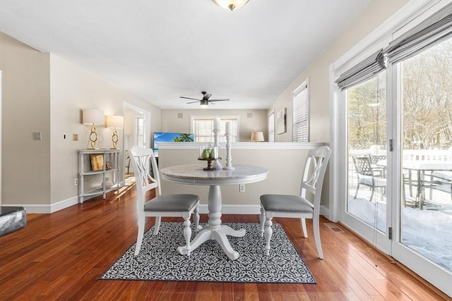 dining area with a healthy amount of sunlight, hardwood / wood-style floors, and ceiling fan