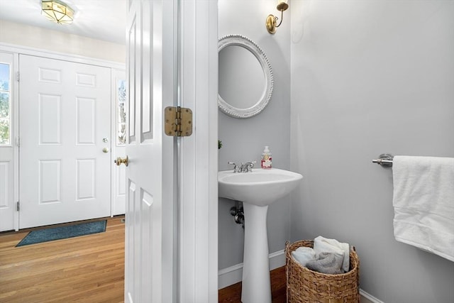 bathroom featuring hardwood / wood-style flooring and sink