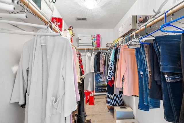 spacious closet featuring hardwood / wood-style floors