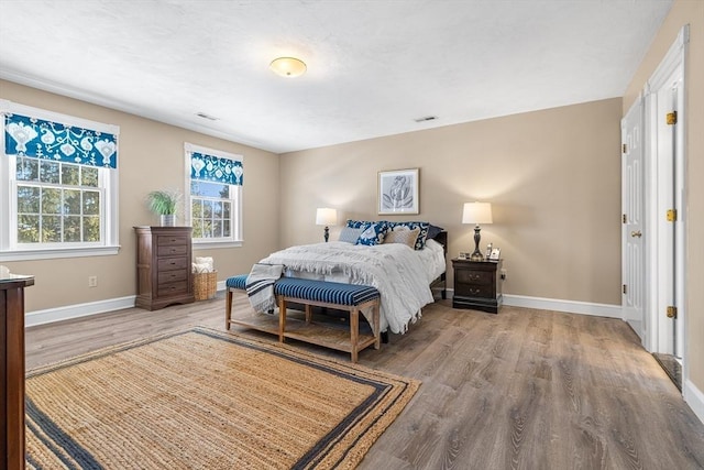 bedroom with wood-type flooring