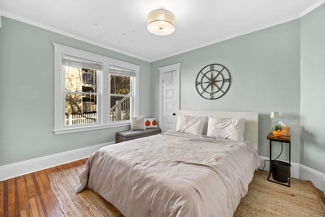 bedroom featuring light hardwood / wood-style floors and ornamental molding