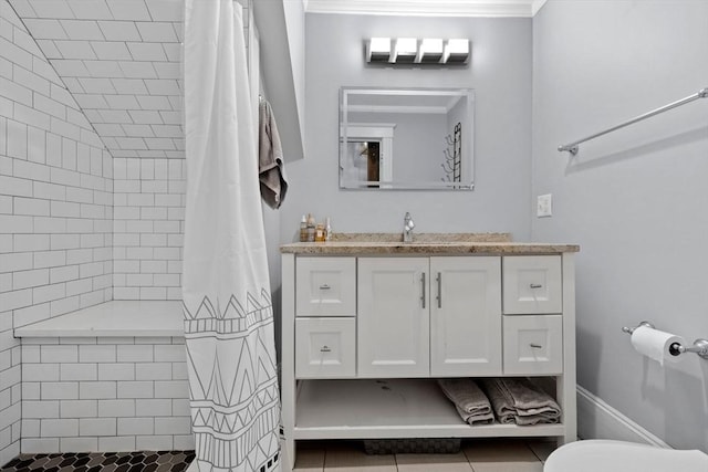 bathroom featuring a shower with shower curtain, vanity, toilet, and tile patterned flooring