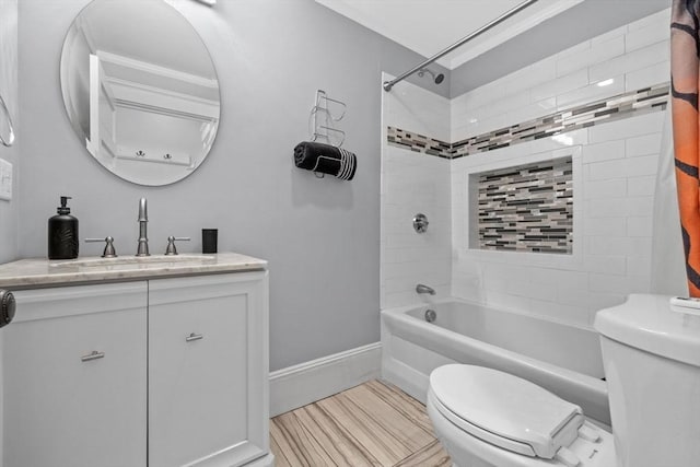 full bathroom featuring tiled shower / bath combo, toilet, and vanity