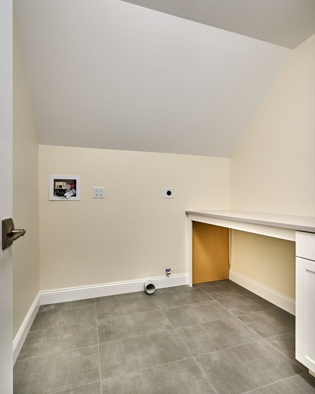 clothes washing area featuring hookup for a washing machine, hookup for an electric dryer, and tile patterned floors