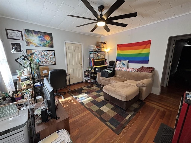 office featuring ceiling fan, visible vents, wood finished floors, and crown molding