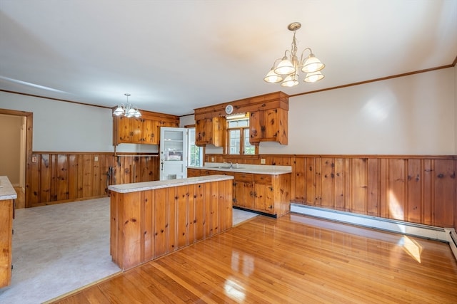 kitchen featuring a chandelier, pendant lighting, and a kitchen island