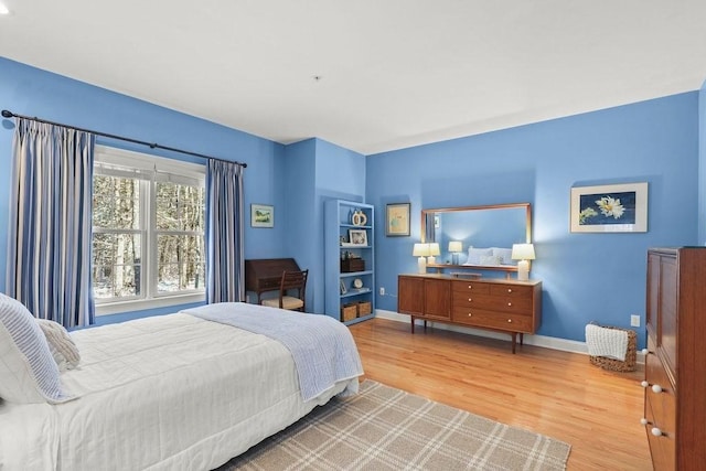 bedroom with light hardwood / wood-style flooring