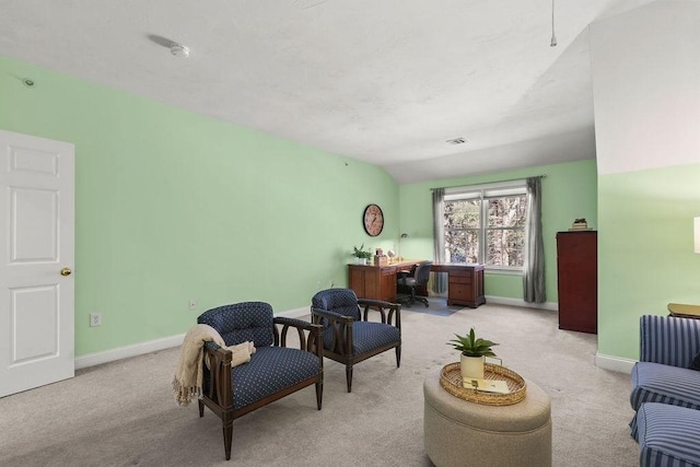 living area with lofted ceiling and light colored carpet