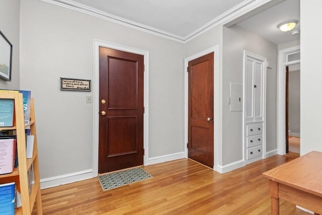 5 Arlington St Unit 31, Cambridge, MA 02140 - entrance foyer featuring light wood-style flooring, baseboards, and crown molding