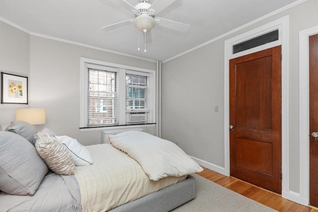 5 Arlington St Unit 31, Cambridge, MA 02140 - bedroom featuring ornamental molding, wood finished floors, baseboards, and a ceiling fan