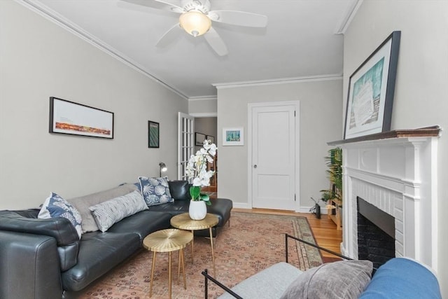 5 Arlington St Unit 31, Cambridge, MA 02140 - living room with wood finished floors, crown molding, ceiling fan, a fireplace, and baseboards