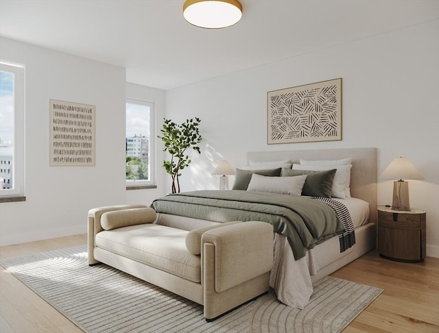 bedroom featuring light wood-type flooring and baseboards