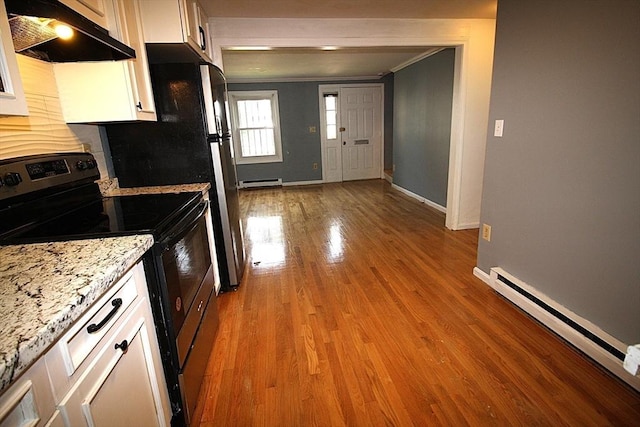 17 Fairland St Unit 17, Boston, MA 02119 - kitchen with electric range, under cabinet range hood, baseboards, a baseboard heating unit, and crown molding
