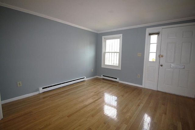 17 Fairland St Unit 17, Boston, MA 02119 - entryway featuring a baseboard heating unit, wood finished floors, baseboards, and crown molding