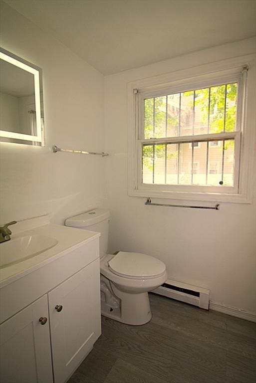 17 Fairland St Unit 17, Boston, MA 02119 - bathroom with baseboard heating, plenty of natural light, vanity, and toilet