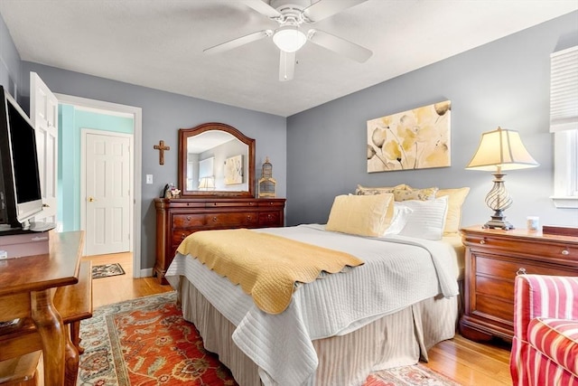 bedroom featuring wood finished floors and ceiling fan