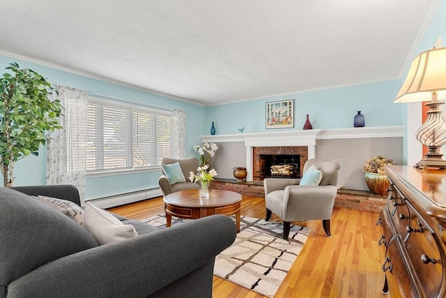 living area with baseboard heating, a brick fireplace, light wood-style floors, and crown molding