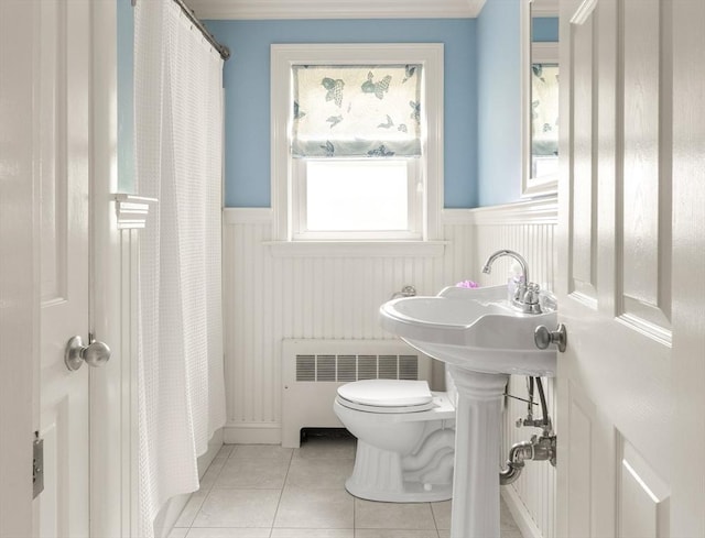 56 Postgate Rd, Hamilton, MA 01982 - bathroom with radiator, a wainscoted wall, toilet, tile patterned floors, and curtained shower