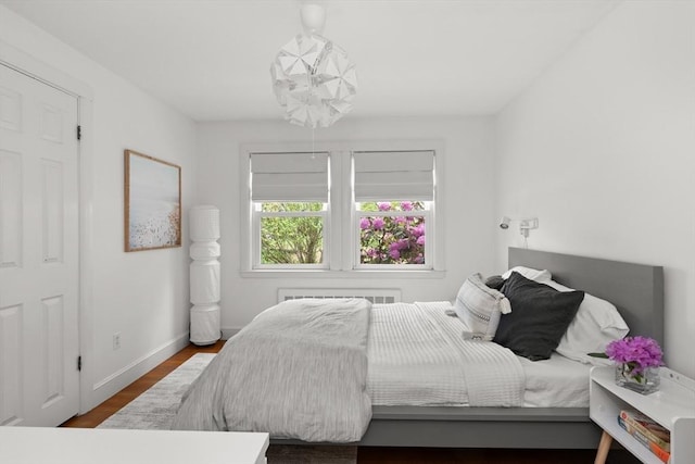 56 Postgate Rd, Hamilton, MA 01982 - bedroom featuring wood finished floors, radiator, and baseboards