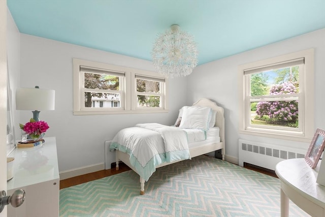 56 Postgate Rd, Hamilton, MA 01982 - bedroom featuring radiator heating unit, baseboards, and wood finished floors