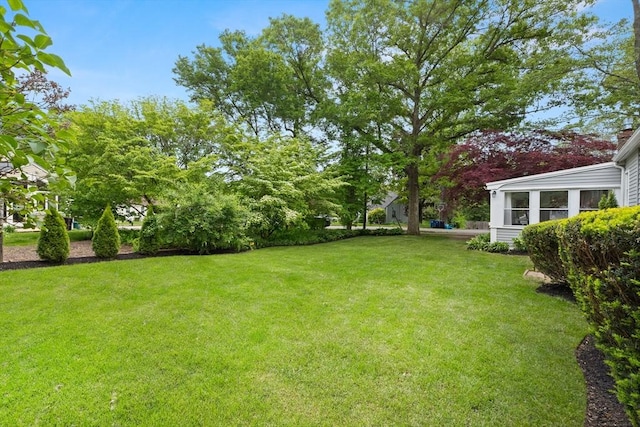 56 Postgate Rd, Hamilton, MA 01982 - view of grassy yard featuring a sunroom