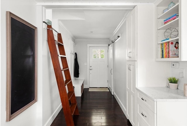 56 Postgate Rd, Hamilton, MA 01982 - doorway to outside with dark wood finished floors, ornamental molding, baseboards, and a barn door