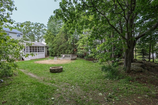 10 Emile Cir, Malden, MA 02148 - view of green lawn featuring a fire pit and a sunroom