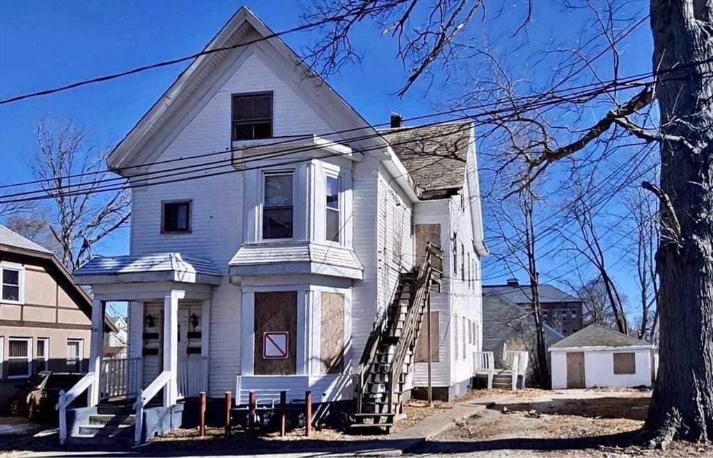 view of front of property featuring stairs