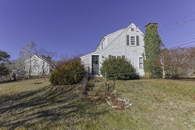 view of home's exterior featuring a lawn