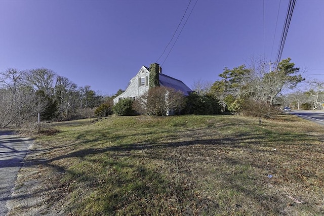 view of home's exterior with a yard