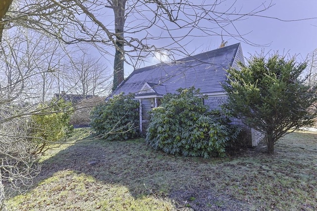 view of property exterior featuring a yard