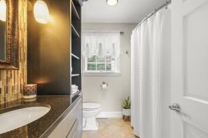 5 Lancaster Ln, Bourne, MA 02532 - bathroom featuring vanity, tile patterned floors, and a shower with shower curtain
