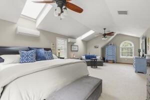 5 Lancaster Ln, Bourne, MA 02532 - carpeted bedroom featuring lofted ceiling, a wall mounted AC, and a skylight